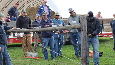 Clinic attendees practiced tying a proper knot around an H-post.
